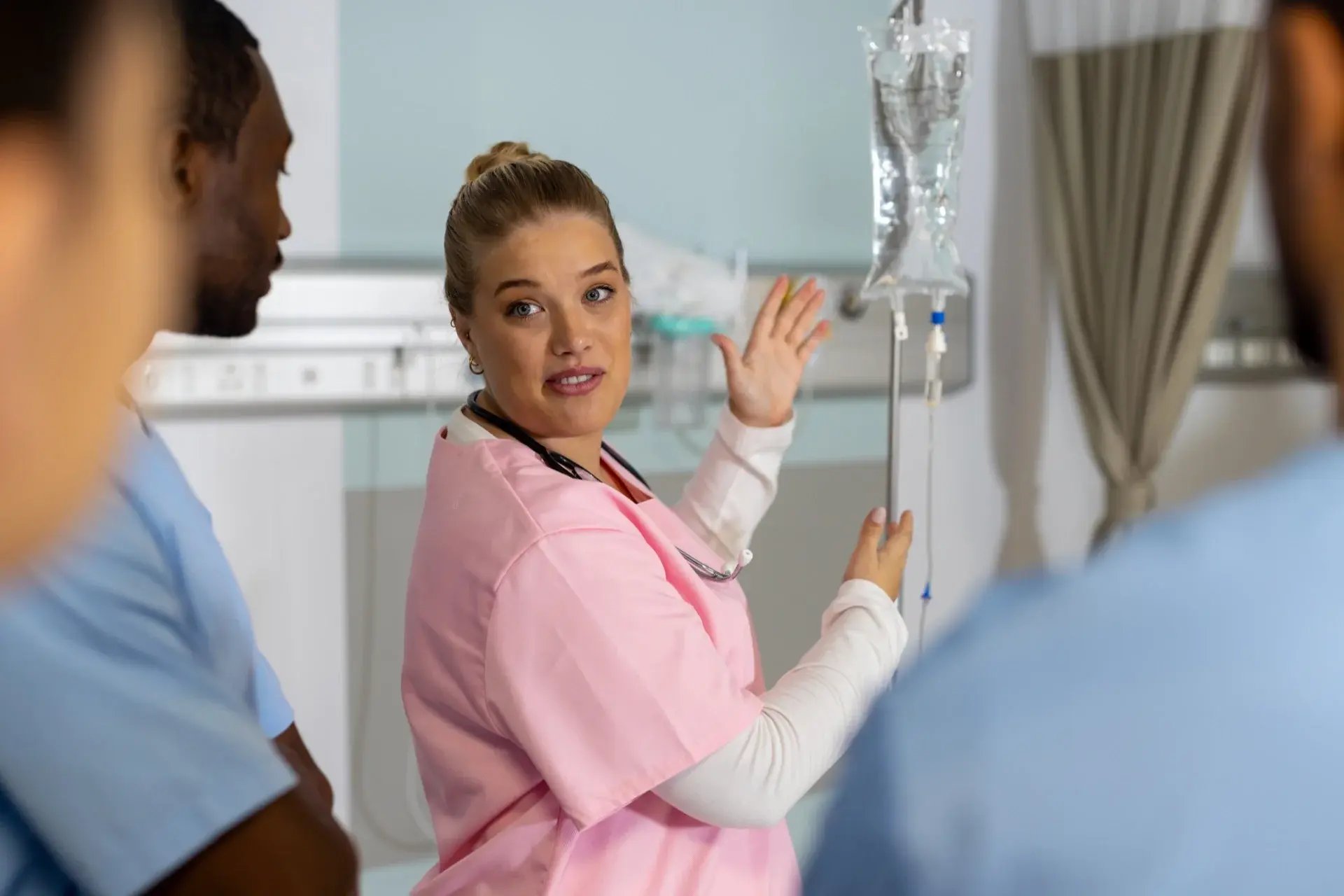 caucasian-female-doctor-with-diverse-trainee-docto-2023-11-27-05-34-03-utc