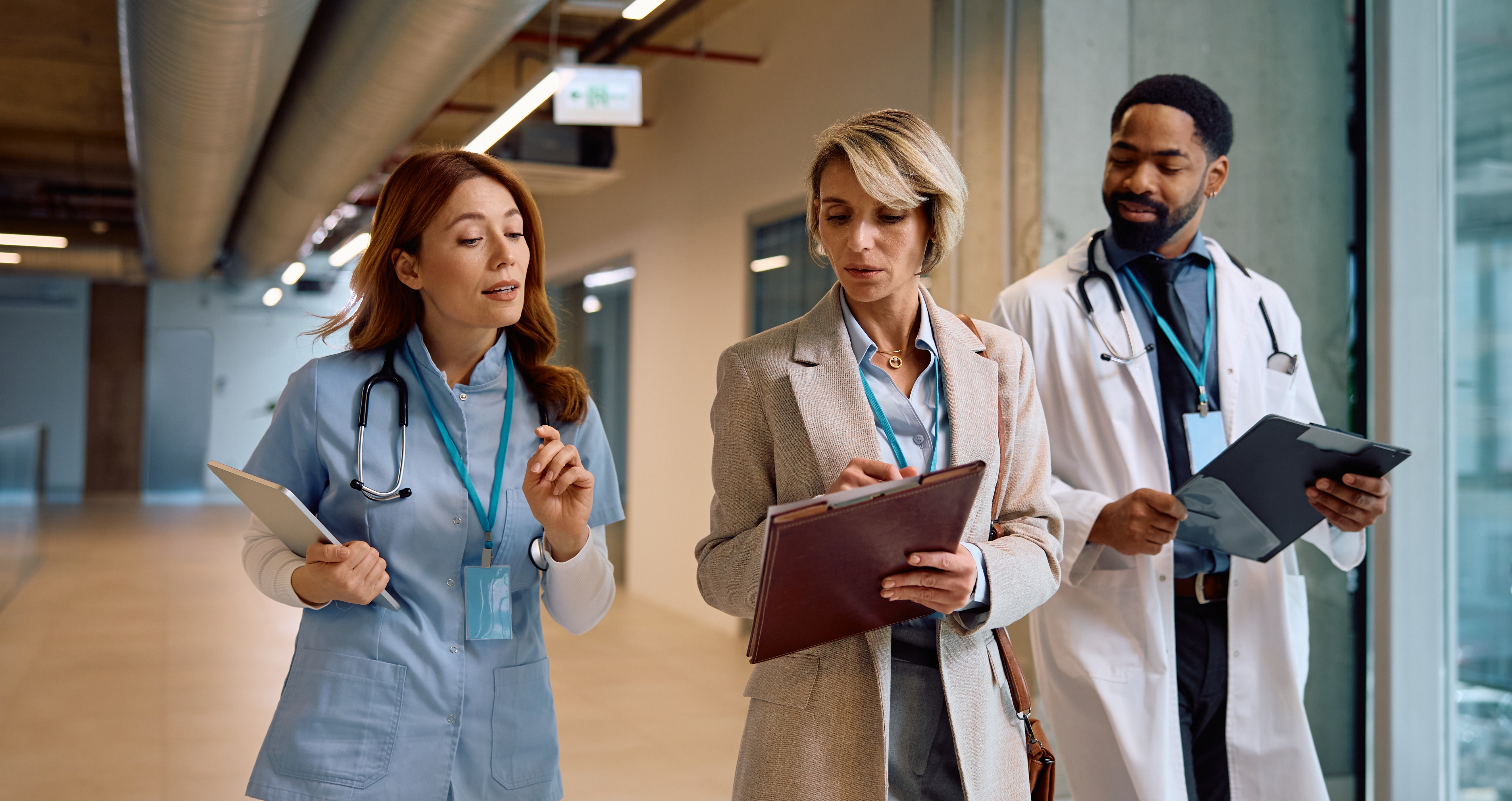 businesswoman-and-doctors-cooperating-while-analyz-2026-01-09-10-52-10-utc